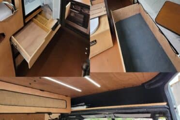 Ausgebauter Innenraum eines Campervans mit Küche und Sitzbank