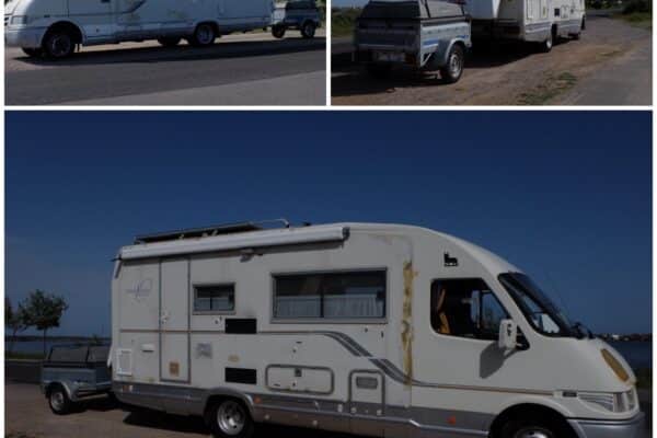 Camping-car blanc avec remorque au bord de l’eau